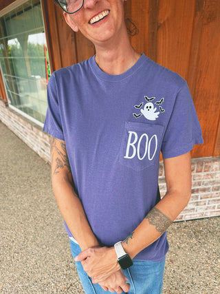 Grape purple BOO pocket tee with ghost and bats modeled by an A Gathering Place team member