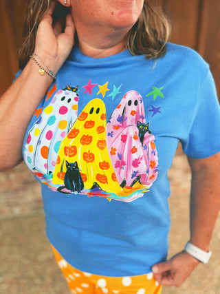 Neon Ghost Trio Halloween graphic tee modeled by an A Gathering Place team member