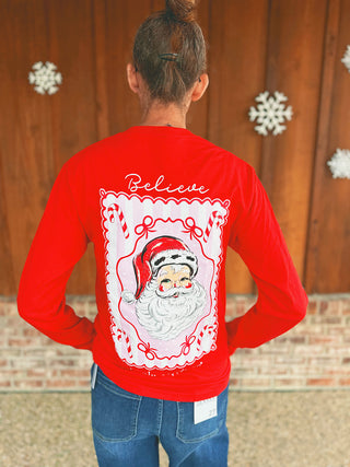 Simply Southern red Believe Santa peppermint long sleeve tee, modeled by an A Gathering Place team member
