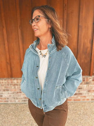 Judy Blue icy blue knit denim bomber jacket on an A Gathering Place team member