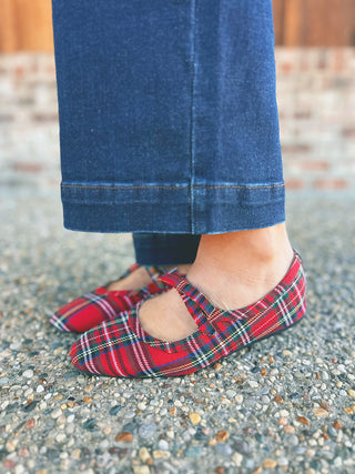 Corky's Layover red plaid Mary Jane slip-on shoes with bow, modeled by an A Gathering Place team member