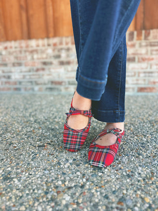 Corky's Layover red plaid Mary Jane slip-on shoes with bow, modeled by an A Gathering Place team member