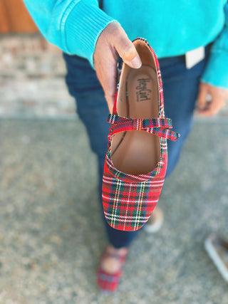 Corky's Layover red plaid Mary Jane slip-on shoes with bow, modeled by an A Gathering Place team member