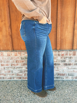 Zenana high rise wide leg pintuck denim pants modeled by an A Gathering Place team member