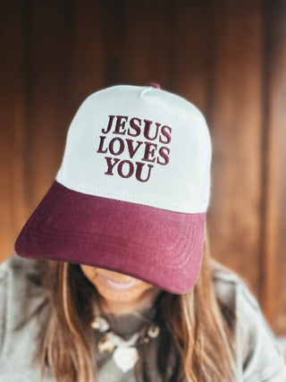 Zenana Jesus Loves You mesh snapback hat in raisin, modeled by an A Gathering Place team member