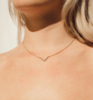 'Extraordinary Things Ahead' Gold Arrowhead Necklace by Lumiela